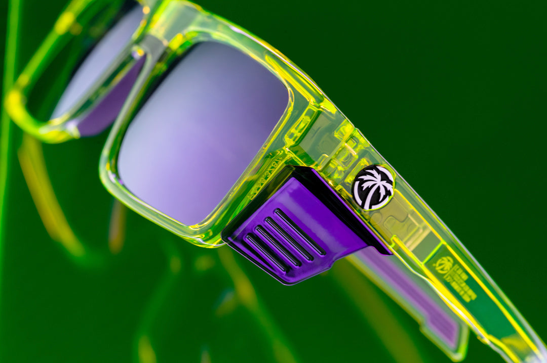 Close up shot of the Performance Rayth Sunglasses: Antifreeze Z87+ with side shields on a neon green platform