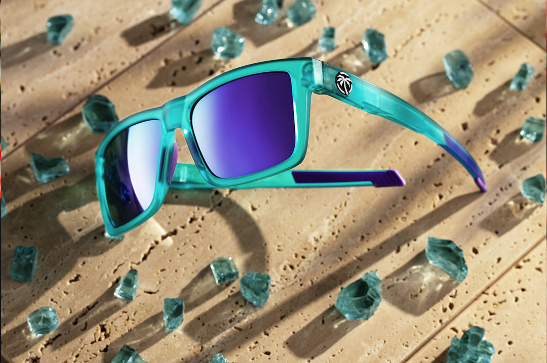 Heat Wave Performance XL Vise sunglasses with purple lenses and aqua frame pictured with broken glass