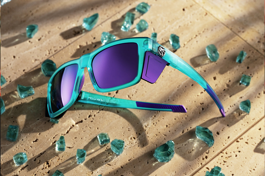 Heat Wave Performance XL Vise sunglasses with purple lenses and aqua frame pictured with broken glass