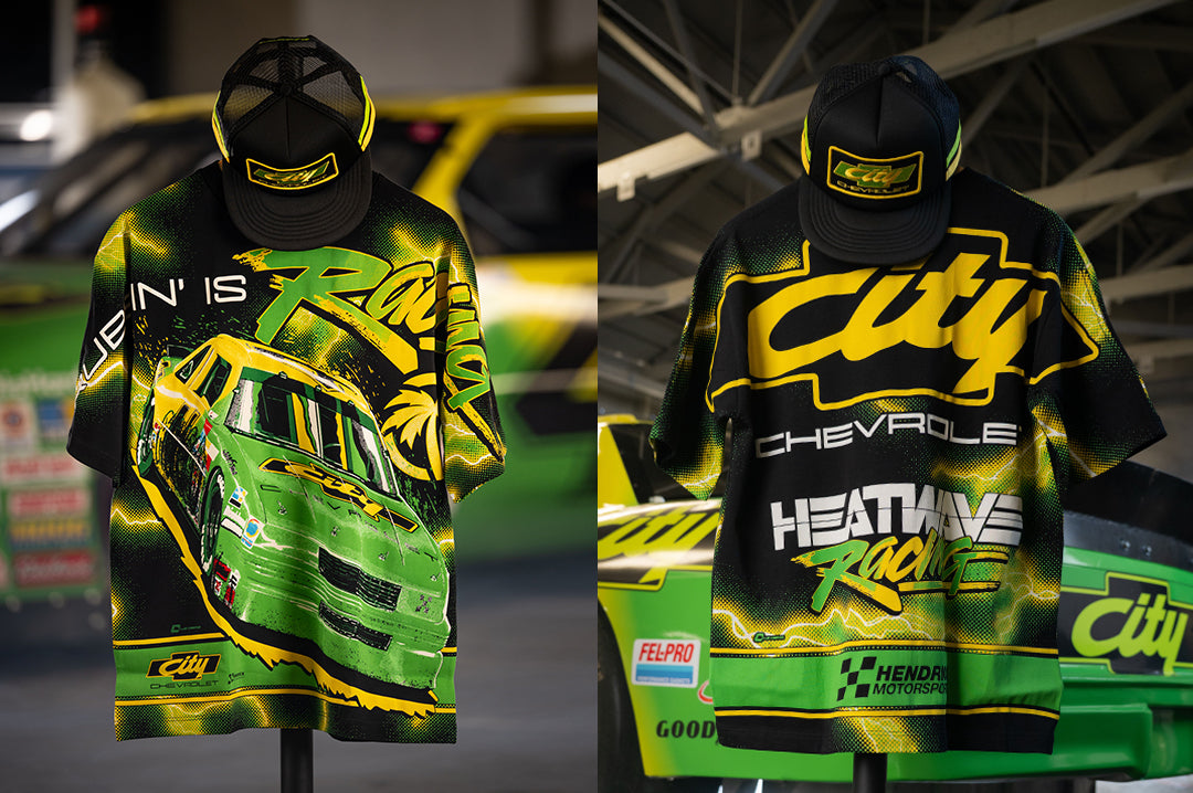 Hanging in front the race car is the City of Chevrolet X HWV T-shirt.