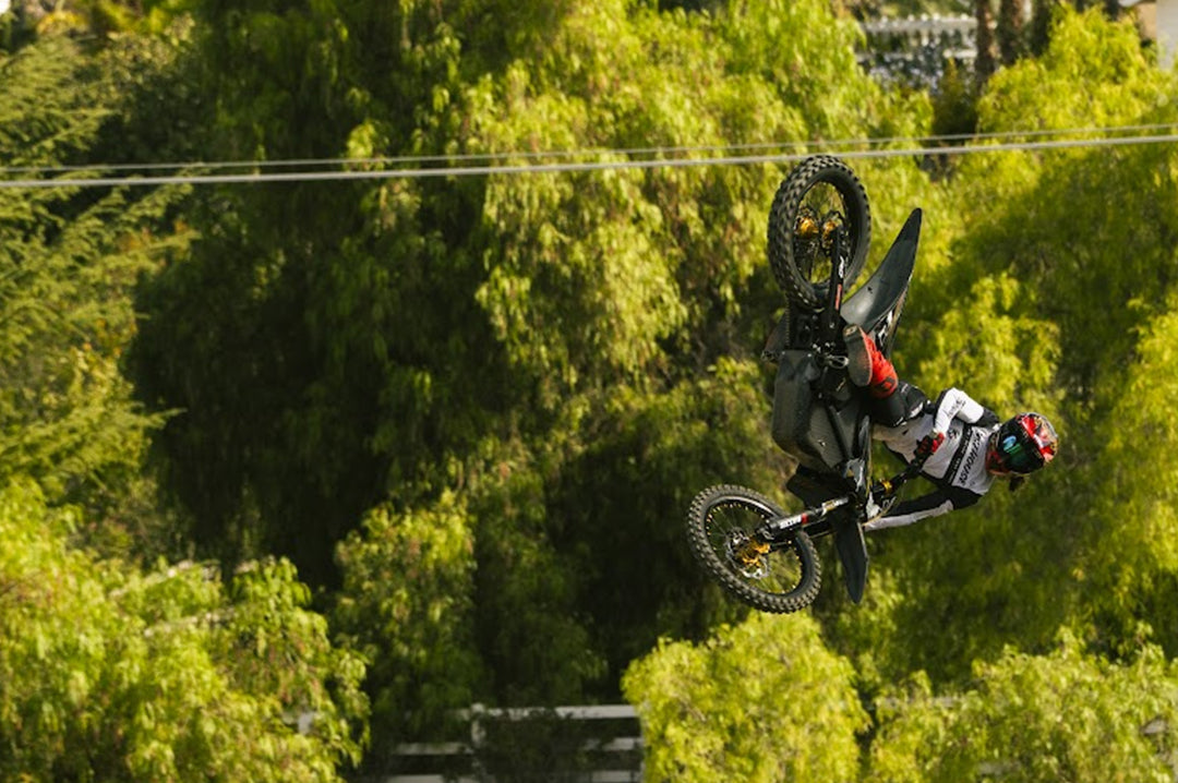 Action shot of Patrick Evans in air on his dirt bike.