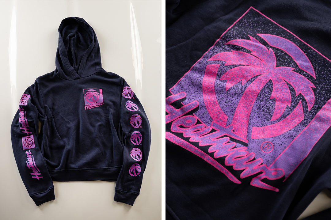 Lying on the floor is the Heat Wave Visual TV Ladies Navy Sweatshirt.