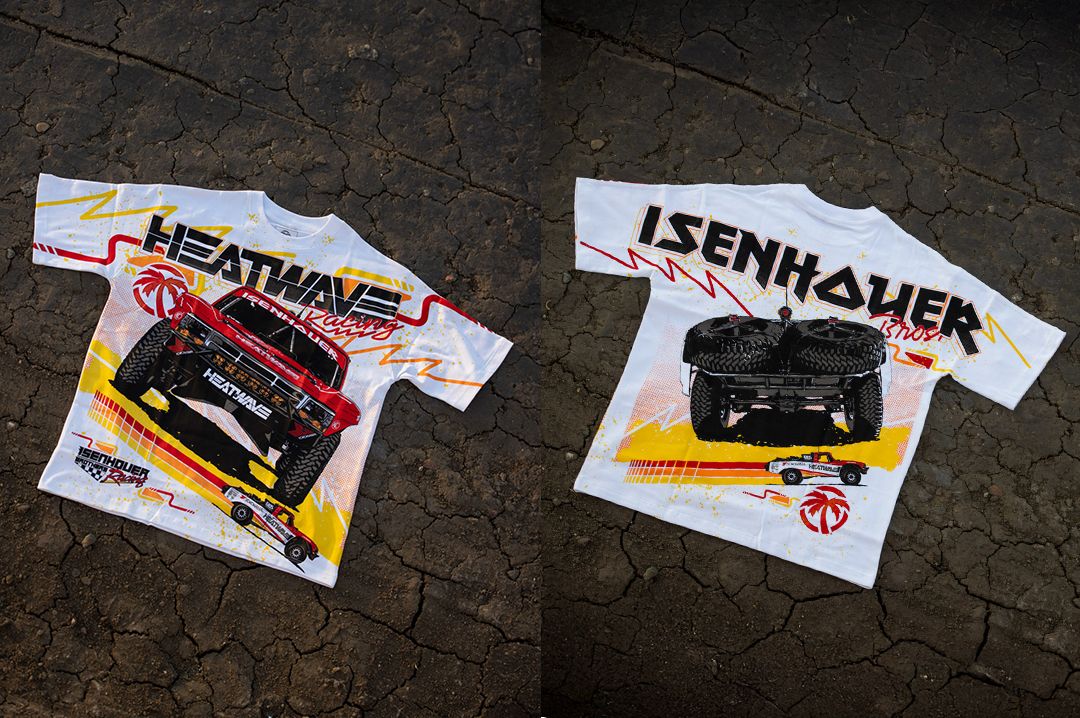 Lying on asphalt is the Heat Wave Visual Isenhouer Racing T-shirt.