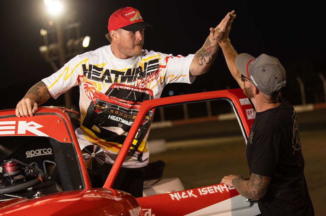 Dillon rocking the Heat Wave Visual Isenhouer Racing T-shirt while give Nick Isenhouer a high five.