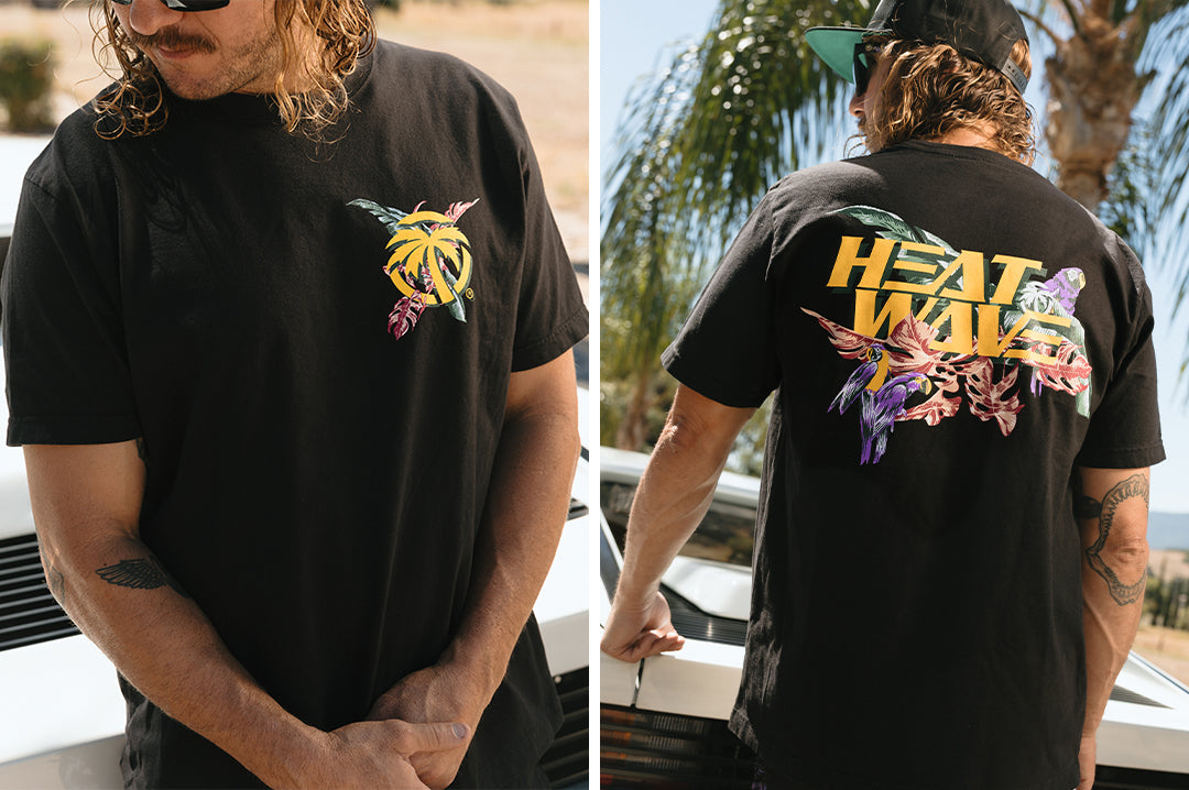 Man wearing the Heat Wave Magnum T-Shirt - Black showing the front and back side