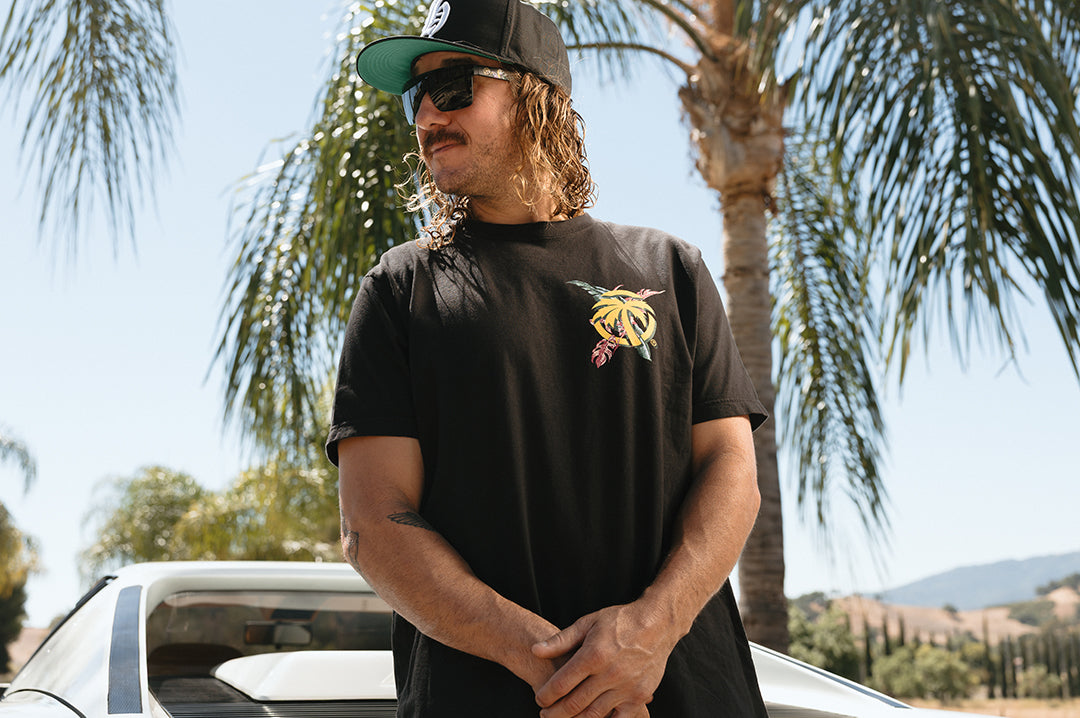 Man wearnig the Heat Wave Magnum T-Shirt - Black
