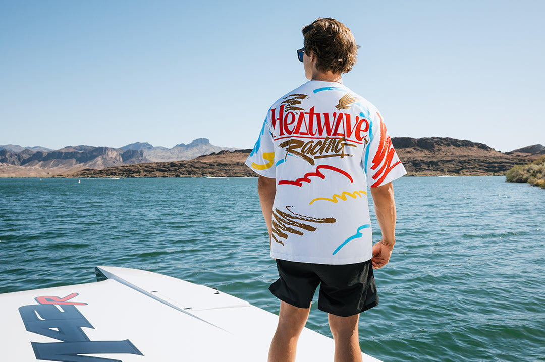 Man wearing the Heat Wave Offshore T-Shirt - White on a boat