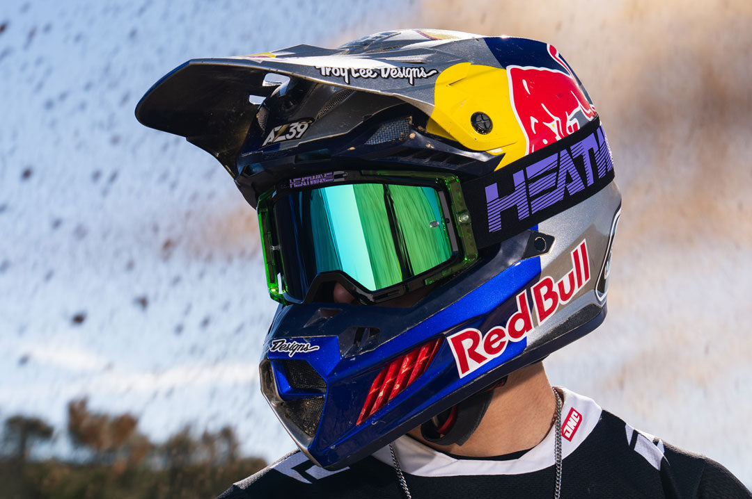 Male model wearing Heat Wave Visual MXG 250 Motorsport Goggle in the Hydro Digger color way with a Piff lens.
