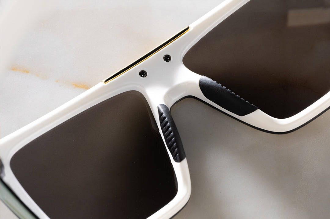 Close up shot of the backside of the Performance Quatro Sunglasses: GLOSS WHITE Gold Lens Z87+