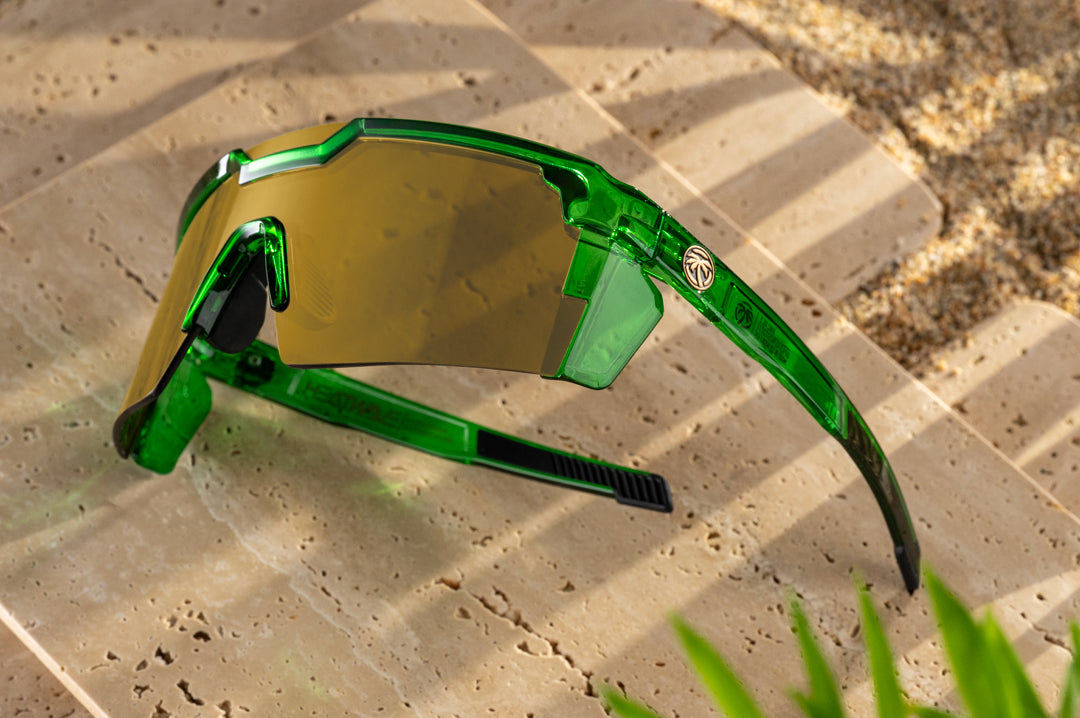 3/4 angle of the Future Tech Sunglasses: Cycad Green Z87+ on concrete