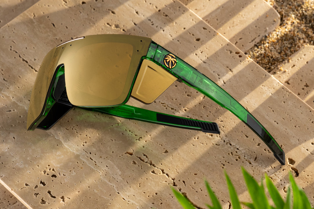The Performance Quatro Sunglasses: Cycad Green Z87+ on concrete