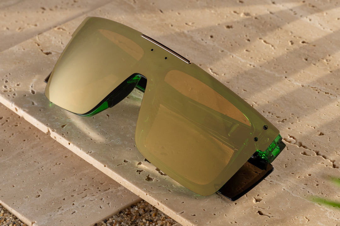 The Performance Quatro Sunglasses: Cycad Green Z87+ on concrete