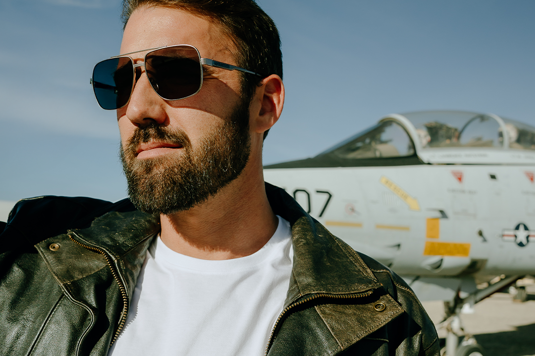 Young dude rocking the Heat Wave Visual Nimitz Sunglasses with gun metal frame and black lenses.
