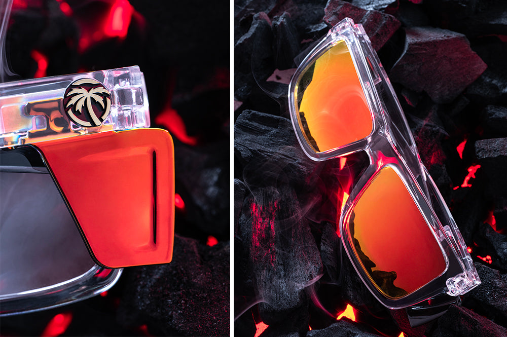 Close up of Heat Wave Performance Vise Vapor Clear Sunblast safety sunglasses with orange red side shields and hot bbq coals behind them.