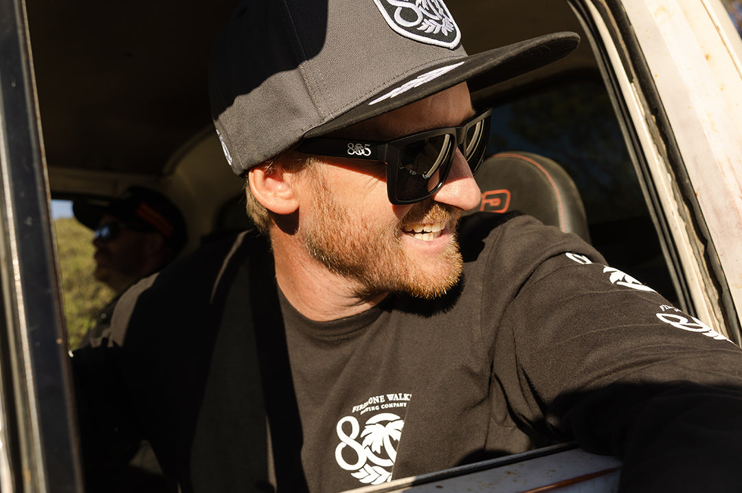 Man wearing the VISE Sunglasses: Heat Wave x 805 in a car