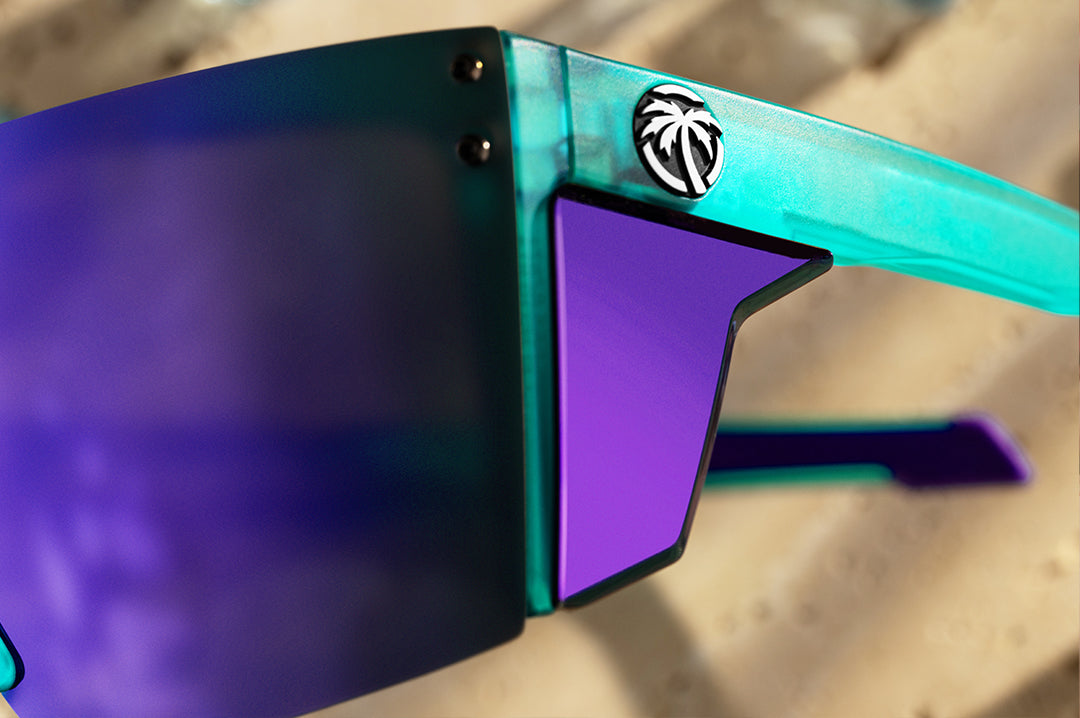 Close up of purple side shields of Heat Wave Performance Lazer sunglasses with purple lenses and aqua frame