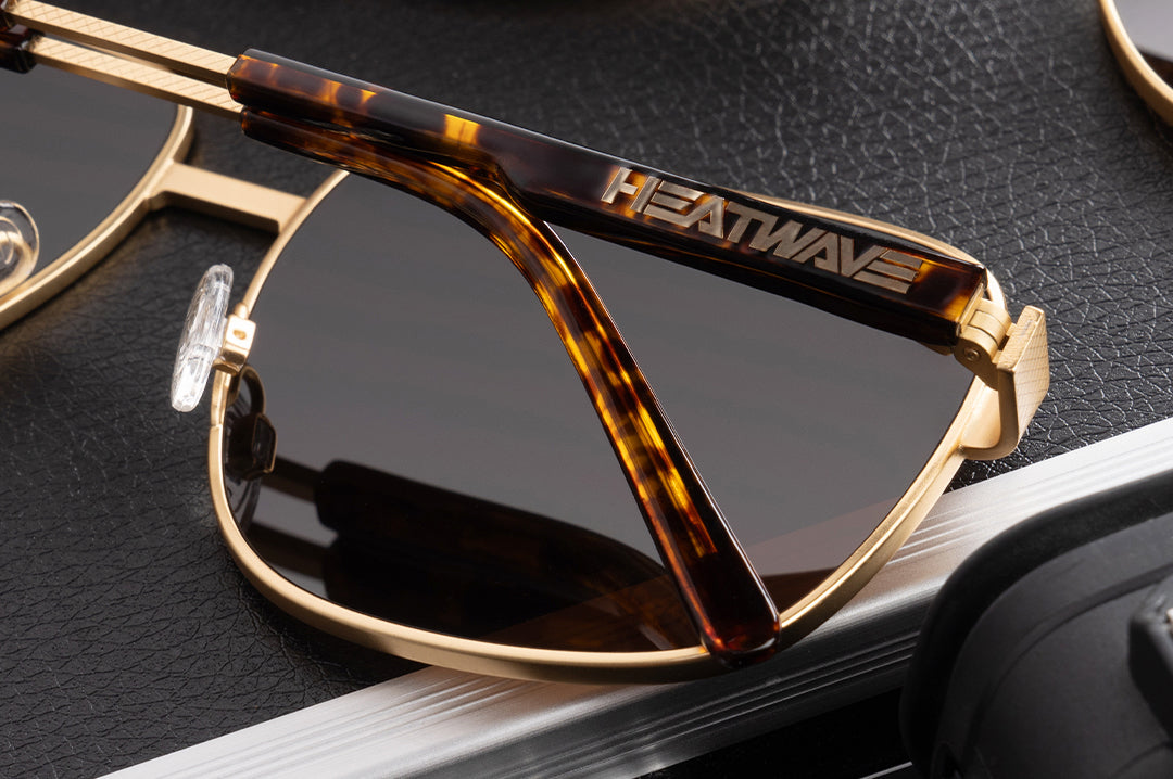 Close up shot of the Nimitz Sunglasses: Tortoise Brown Lens on a case