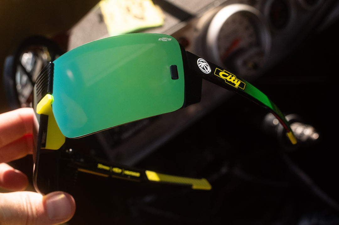 Someone holding the City of Chevrolet x HWV Vector Sunglasses.