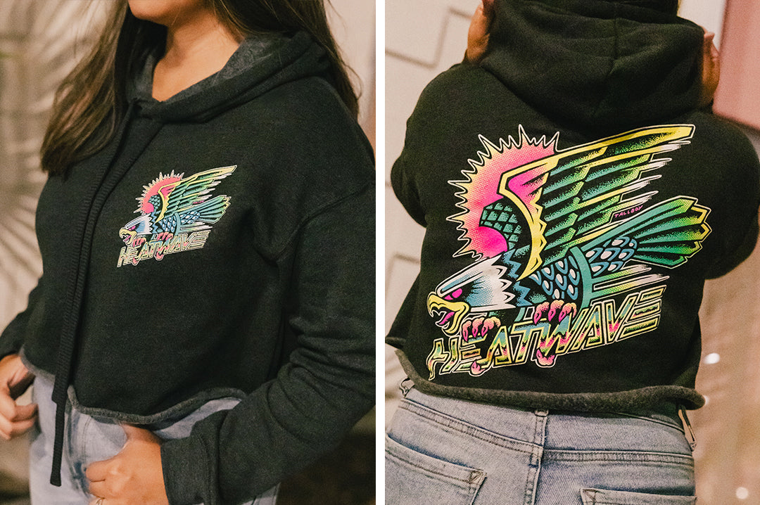 Young lady rocking the Heat Wave Visual Electric Eagle Ladies Crop Sweatshirt.
