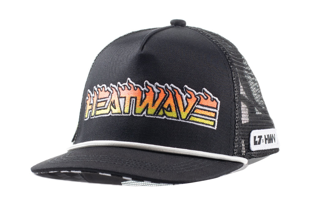 Front angled shot of the Little Trouble X Heat Wave Youth Trucker Hat on a white background. 