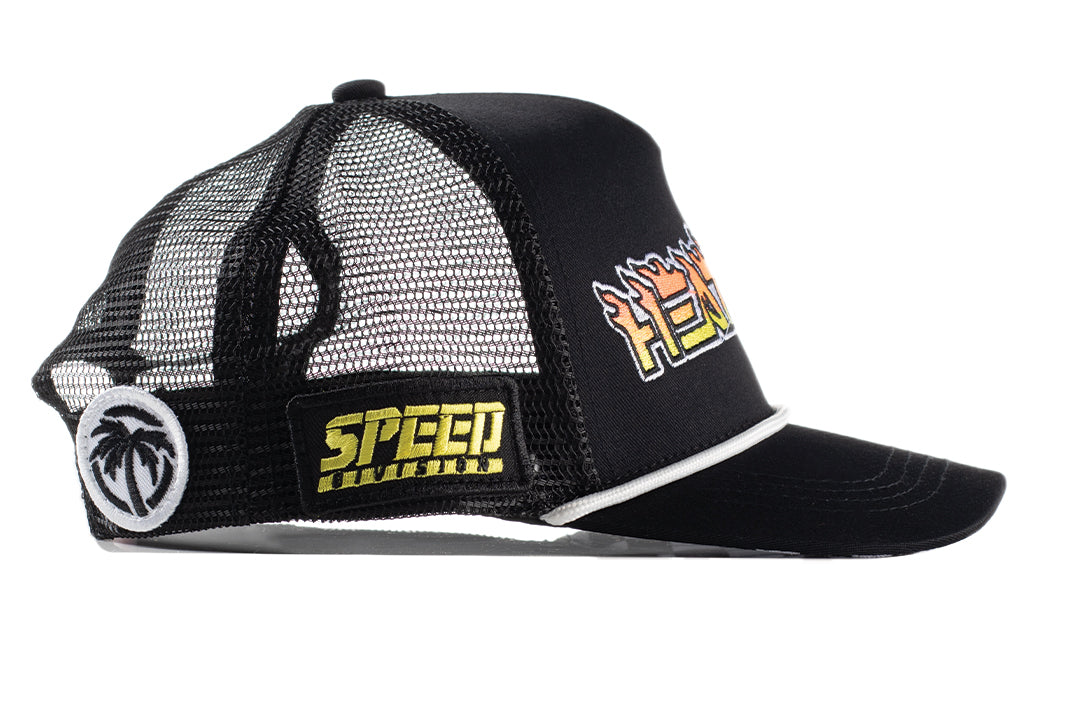 Side view shot of the Little Trouble X Heat Wave Youth Trucker Hat on a white background. 