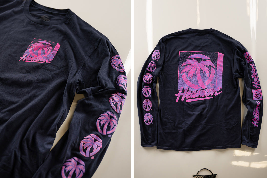 Lying on the hood of the corvette is the Heat Wave TV Navy Long sleeve.