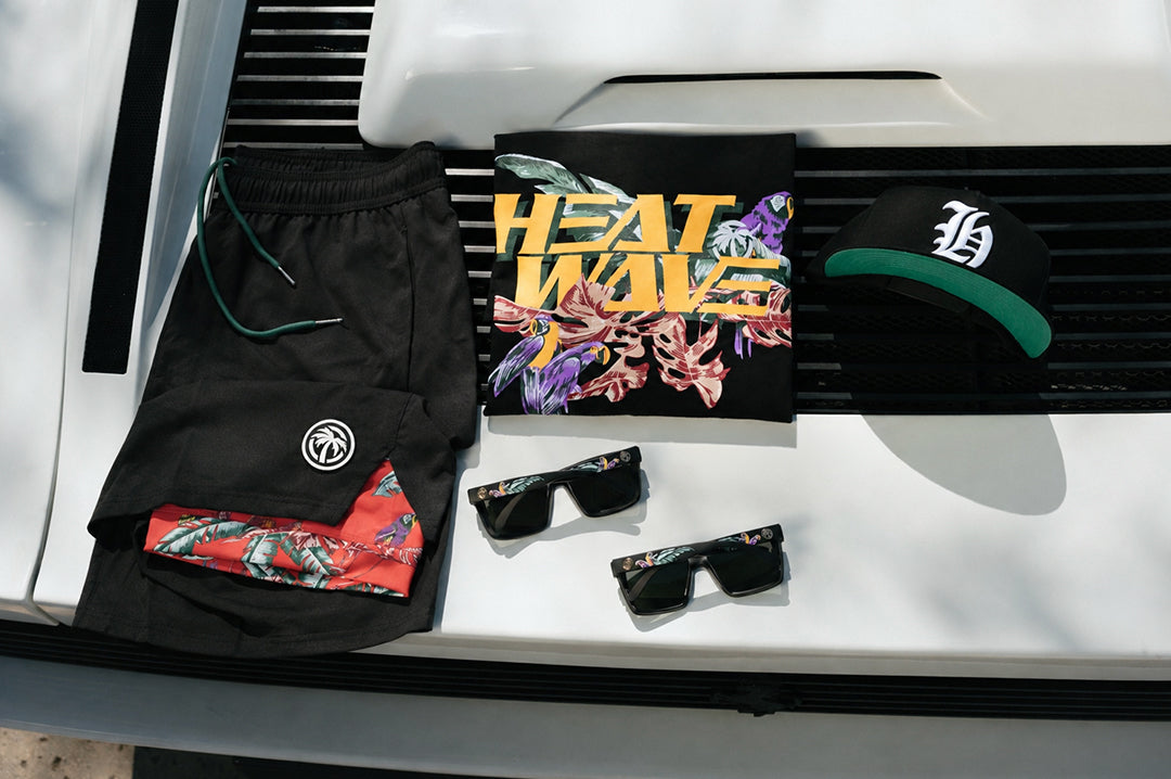 The Heat Wave Magnum Performance Shorts - Black and whole collection placed on top of a car