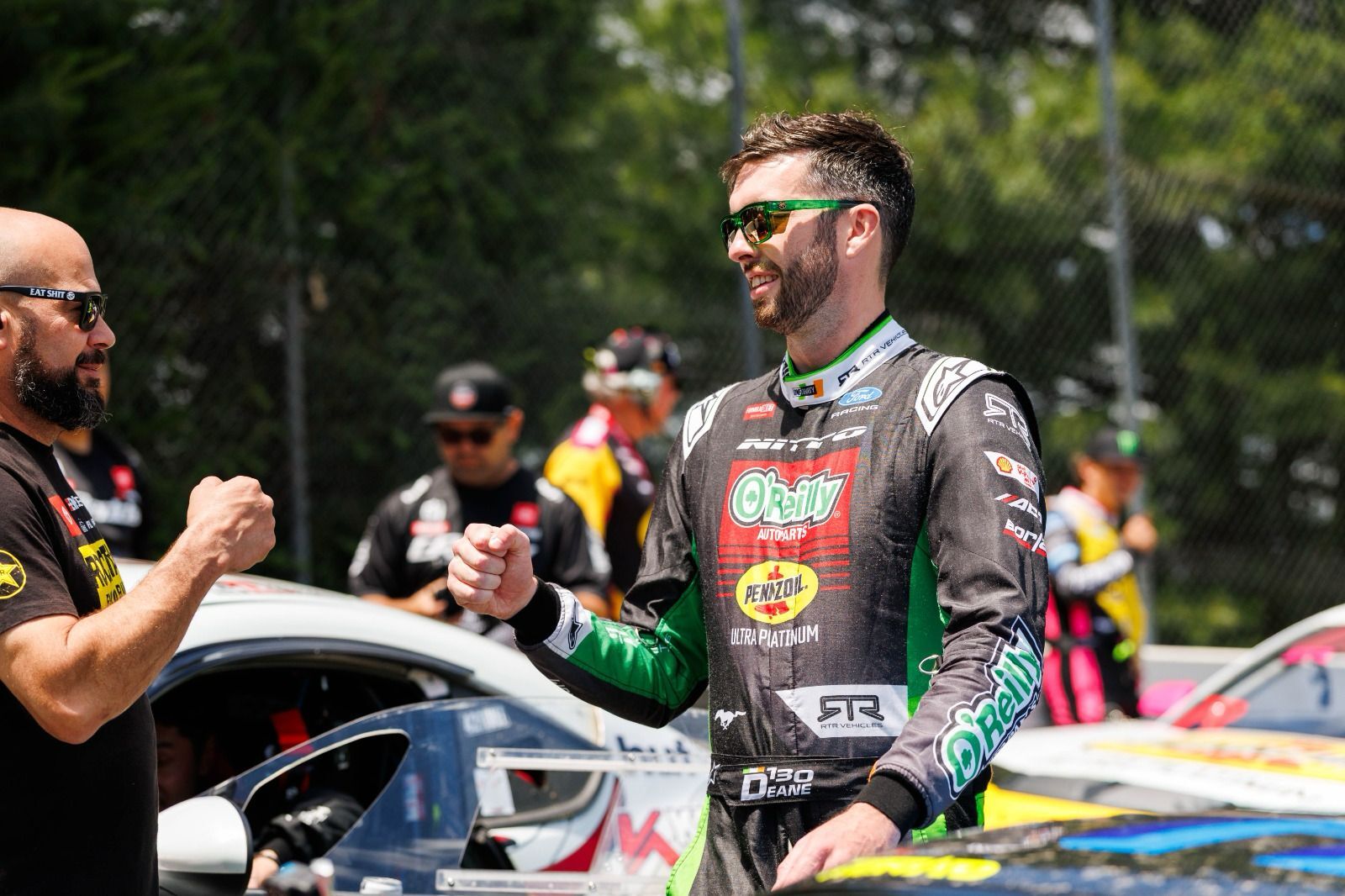Man wearing the Performance Vise Sunglasses: Cycad Green Z87+