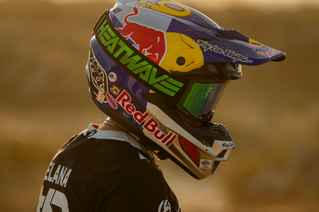 Male model wearing Heat Wave Visual MXG 250 Motorsport Goggle in the Hydro Digger color way with a Piff lens.