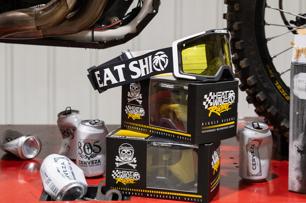 Rusty Butcher Heat Wave Goggles surrounded by empty 805 Cerveza beer cans