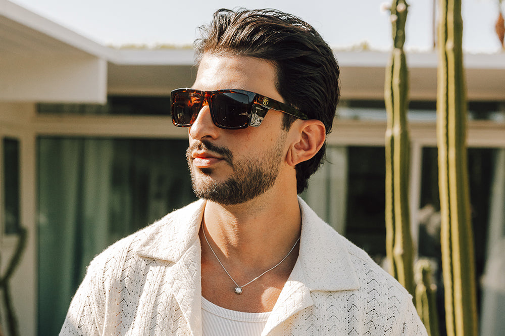 Young dude outside rocking the Heat Wave Visual Performance Vise Tortoise Sunglasses. 