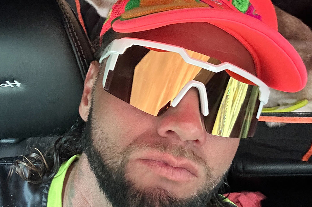 Man wearing the Future Tech Sunglasses: GLOSS WHITE Gold Lens Z87+