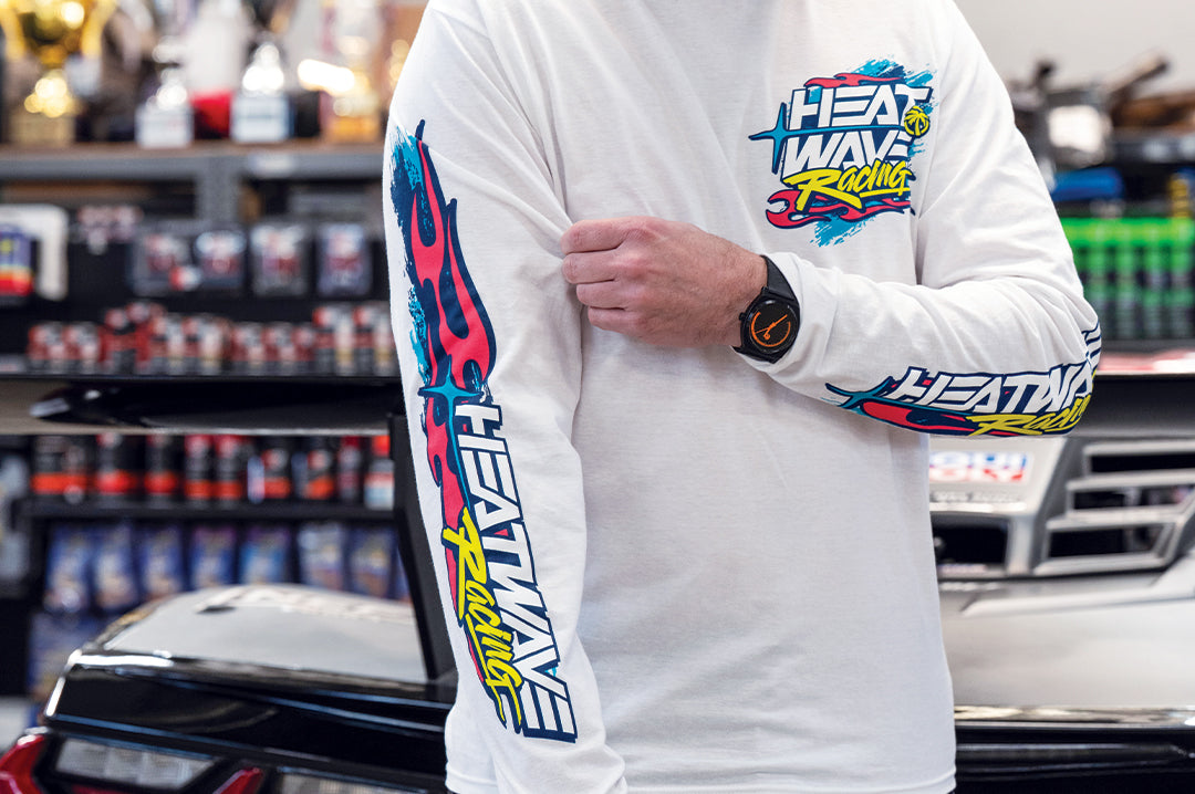 Man wearing the Heat Wave Y2K Racing White Long Sleeve T-Shirt 