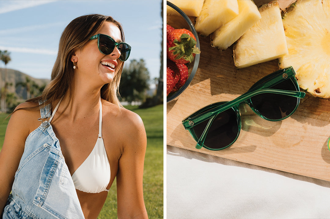 Woman wearing the Carat Sunglasses: Cycad Green and frame next to fruit