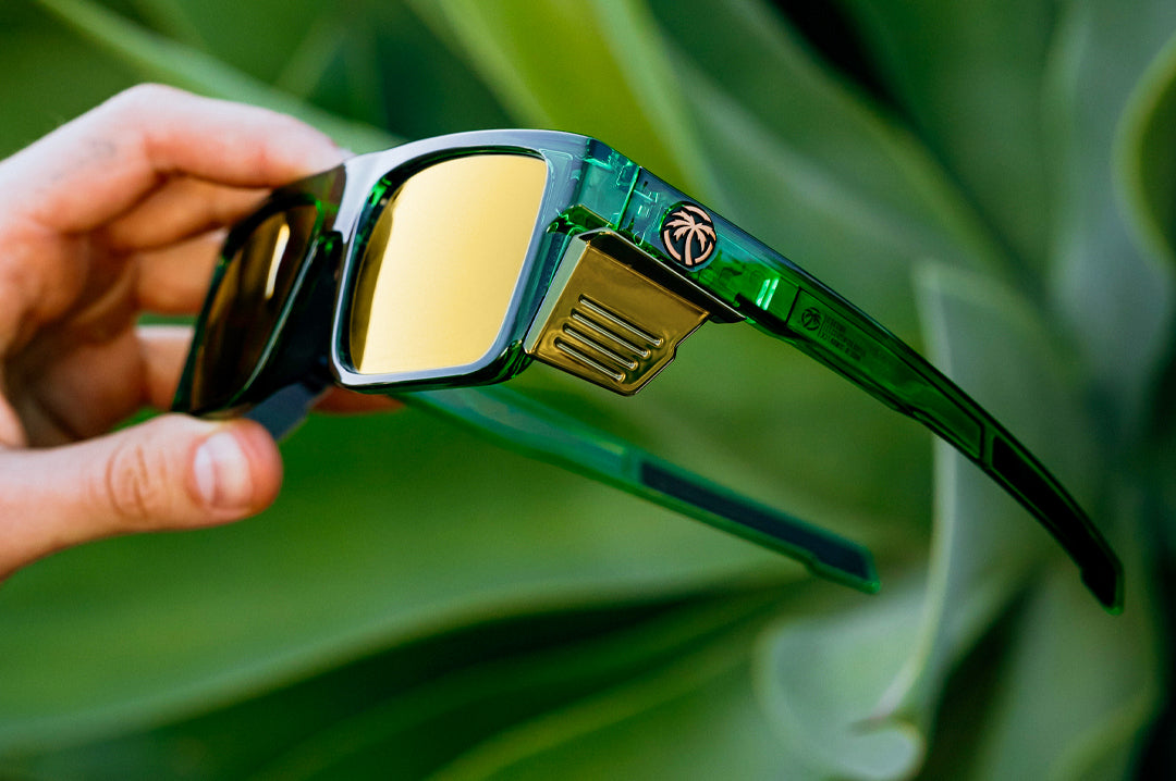Hand holding the Performance Rayth Sunglasses: Cycad Green Z87+