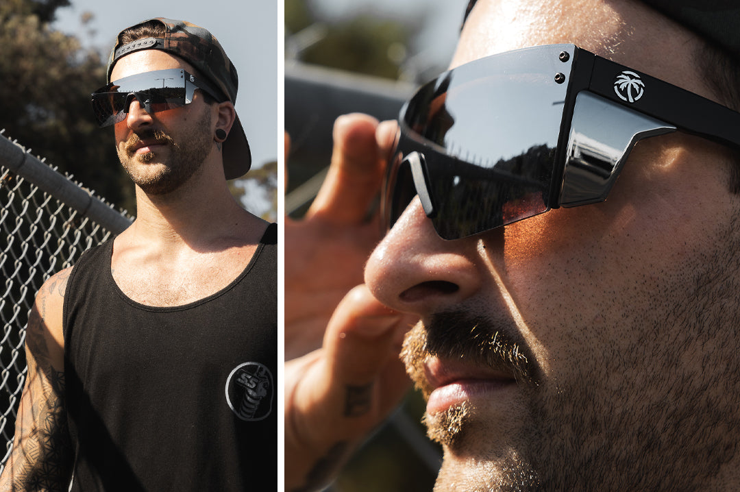 Young dude outside wearing the Heat Wave Visual Performance Lazer Face Sunglasses with black frame, silver lens and matching colored side shields.