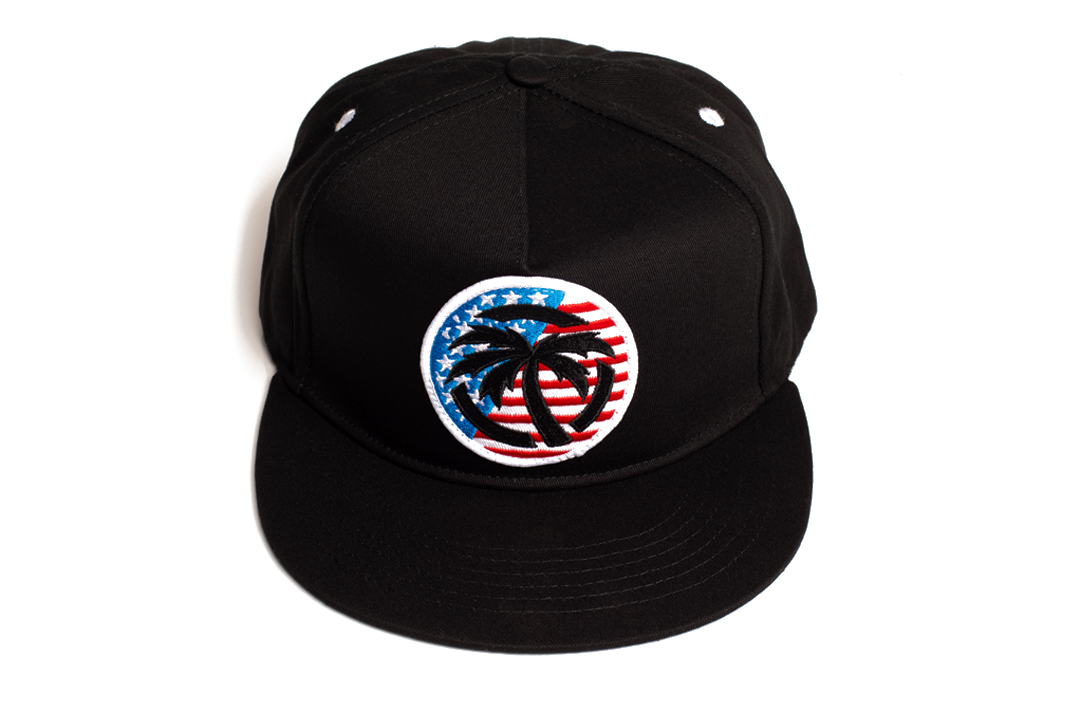 Top of Heat Wave Visual black snapback hat with USA icon patch.