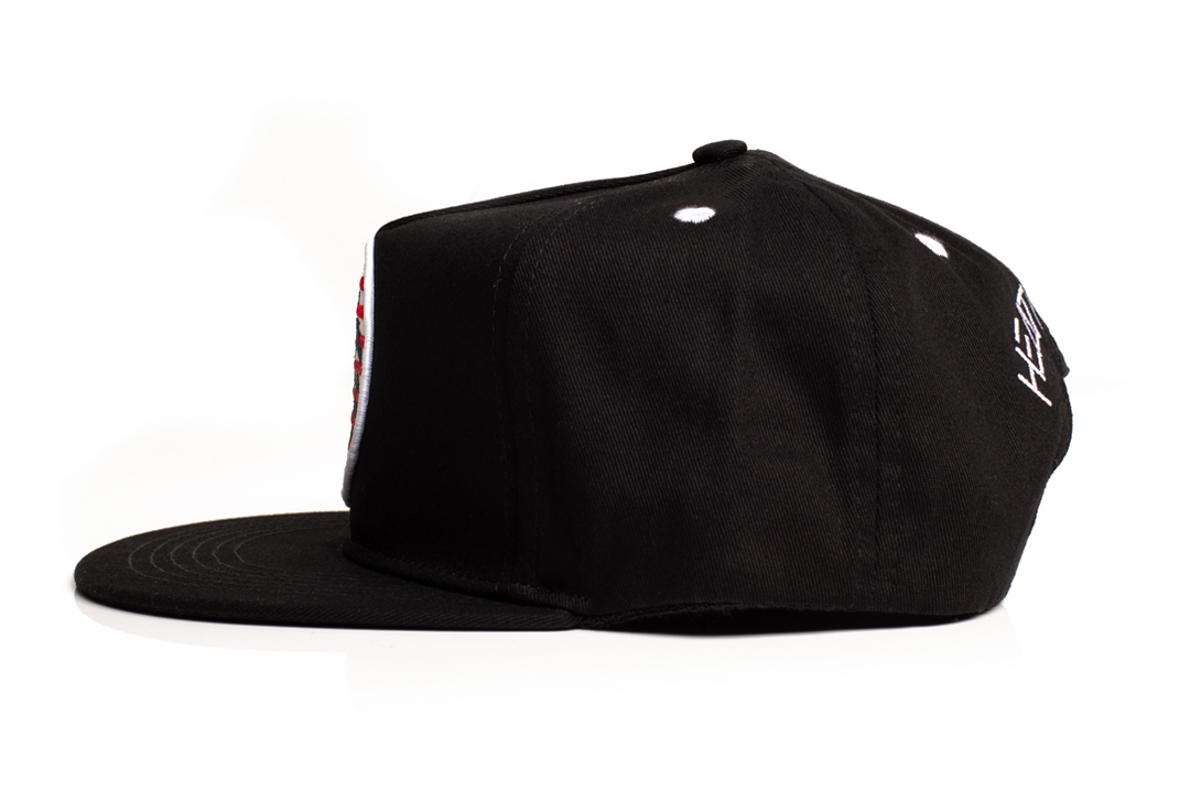 Side of Heat Wave Visual black snapback hat with USA icon patch.