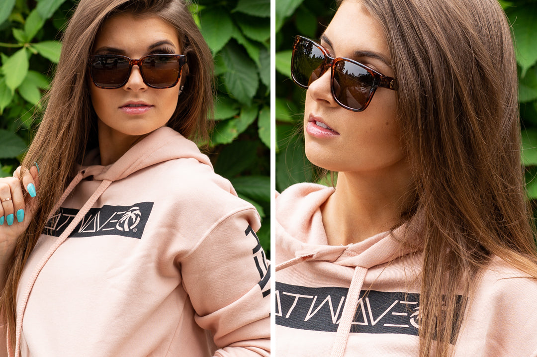 Young women wearing Heat Wave Visual Apollo Sunglasses with tortoise brown frame and brown gradient lenses.